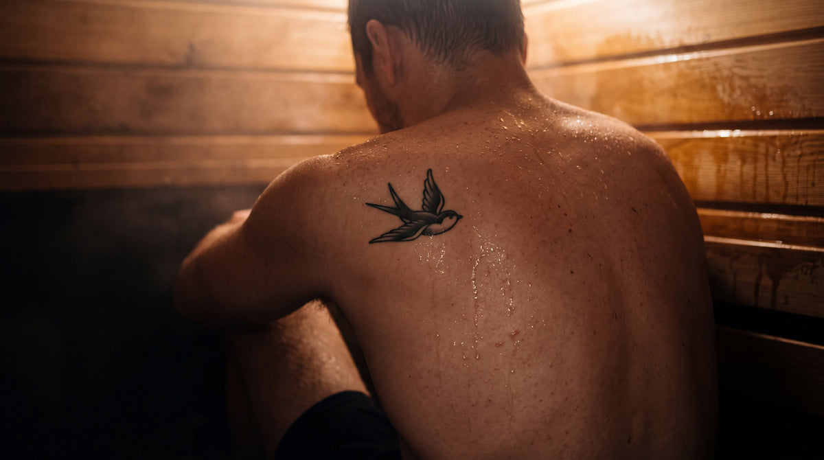 A small traditional swallow tattoo on a sweating shoulder blade in a cedar sauna, do tattoos change the way you sweat